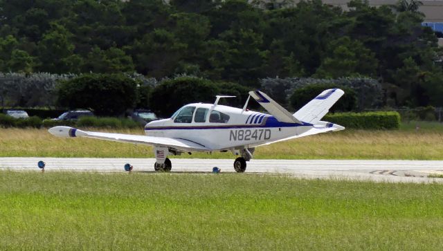Beechcraft 35 Bonanza (N8247D) - Holding short of Rwy 09.
