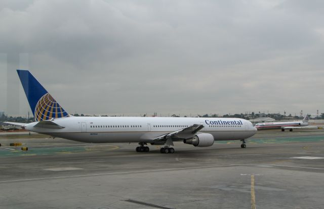 N67052 — - Continental Airlines now owned by United Airlines - Boeing 767-42(ER).  Picture taken at LAX through the window at gate in 2013,
