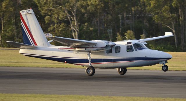 Aero Commander 500 (VH-YJM) - Leaving Gladstone on his weeknight freight run!