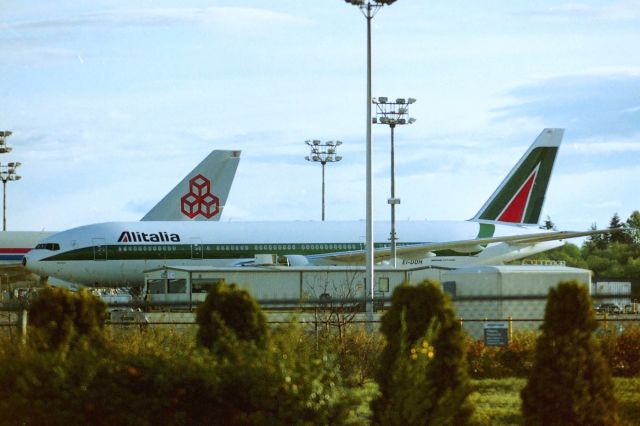 Boeing 777-200 (EI-DDH) - KPAE - New at Boeing-Everett spring 2004. This was the 1st 777-2 that I had seen for Alitalia and this shows delivered May 2004 to the airline. Now shows flying in Skyteam colors March 2012. named "TROPEA" cn:32784 ln: 477. This was the 4th 777-2 to be delivered at the time for Alitalia. photo date apprx Apr 5th, 2004.......LX-UCV is the Cargolux 747F