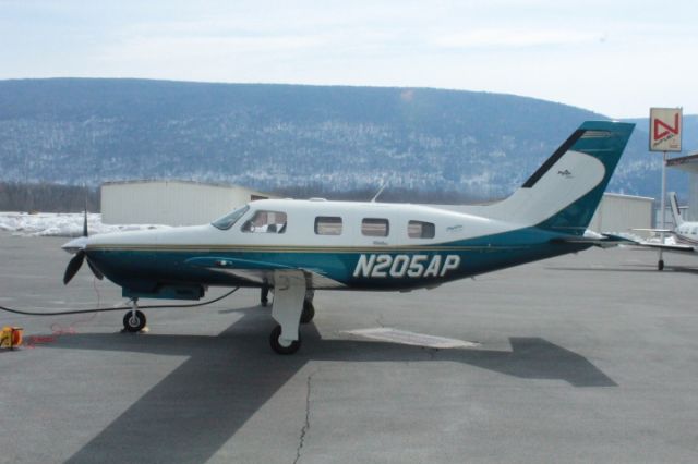 Piper Malibu Mirage (N205AP) - Fueling up right outside the FBO.