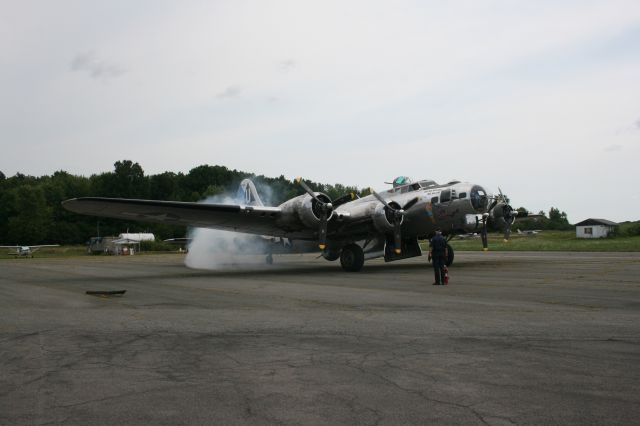 — — - B17G Sentimental Journey starting engines at Schenectady County Airport on August 16,2014