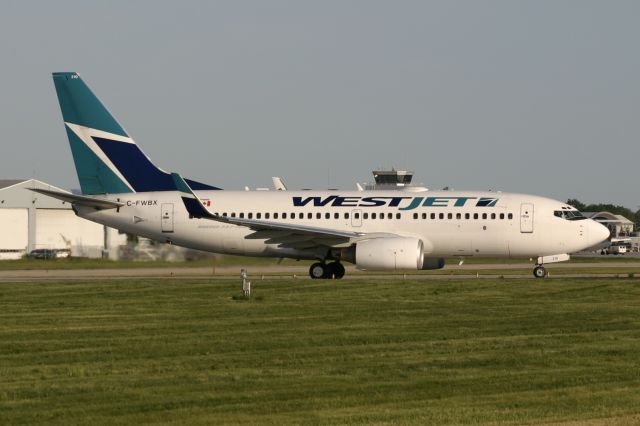 Boeing 737-700 (C-FWBX) - June 10, 2006 - leaving London 