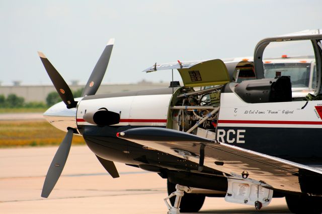 — — - A T-6 getting an inspection on the TAC ramp.