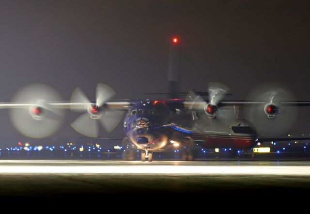 Antonov An-12 (UR-CGV) - UKL5074, a Ukraine Air Alliance AN12BK, pulling into the Grand Aire ramp early this morning, 16 Mar 2022.