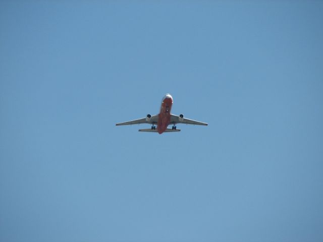 McDonnell Douglas DC-10 (N450AX) - Tanker 910 flying over my house just east of a mid-field approach to McClellan (KMCC)