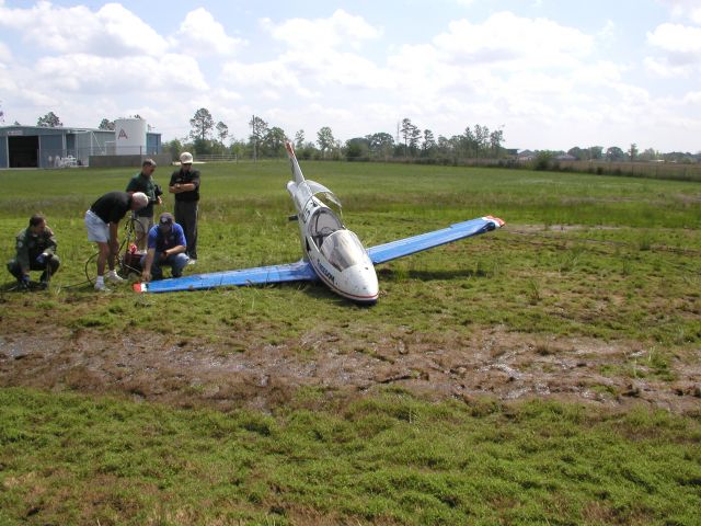 BD-MICRO Micro (BD-5J) (N23AP) - Bede BD-5J runs off the runway during landing. It takes out a VASA light and the gear collapses—picture 7 of 9.