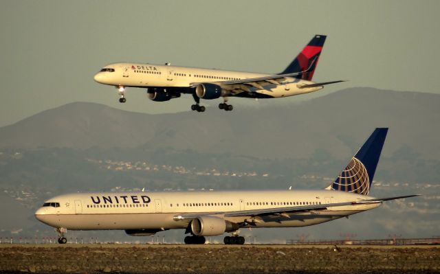 BOEING 767-400 (N66057) - On takeoff roll with a DAL - B752 on Final (N721TW).