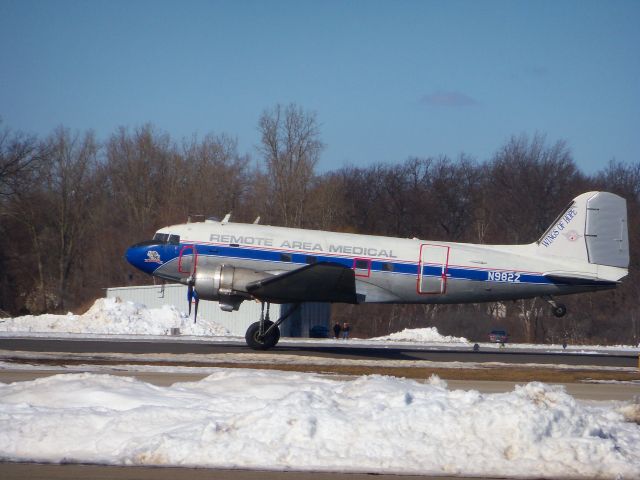 Douglas DC-3 (N982Z) - This beautiful DC3 was originally delivered in 1943 to the U.S. 9th Air Force. Now peacefully serving the needs of people afar, it is seen arriving at Oakland International Airport in Waterford, MI with a load of medical supplies for a Hati relief effort on a beautiful sunny day in March. March 5th 2010