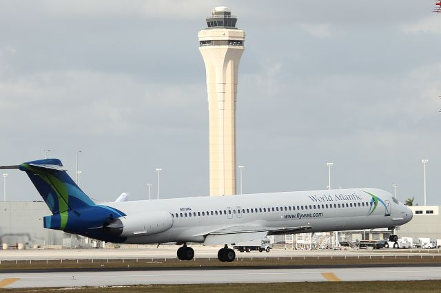 McDonnell Douglas MD-80 (N803WA) - World Atlantic flight 431 from Jose Marti Intl touching down on RWY 9 with Miami tower in   background. Taken from just east of El Dorado Furniture. 3/31/13