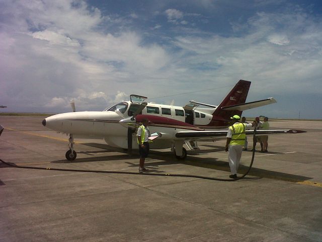 — — - Again taken with my Black Berry this Beechcraft flown by IDC in the Seychelles.  Fueling and after we take off for the island of Coetivy in the Indian Ocean.