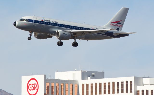 Airbus A319 (N745VJ) - Bucking strong wind gusts that had already forced it to abandon its first approach and go around due to a wind sheer alarm as it was coming over Rock Park, Americans N745VJ, sporting an all new suit of Allegheny Airlines garb with first-time-ever American titles, struggles to get the wings back to level for the last few seconds of its second-attempt s/final approach to runway 16R. The final flare ended up being longer than normal as a blast of wind right up the length of 16R from the south caused it to hang up and then land a bit long, but this landing was completed successfully.