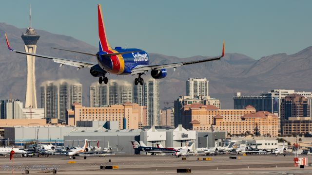 Boeing 737-700 (N7848A) - Las Vegas skyline provides a backdrop for this landing SW 737-700 