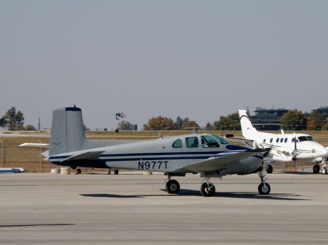 Beechcraft Twin Bonanza (N977T) - Never know what youll see at Blue Grass Airport (KLEX).... like this throaty sounding Twin Bonanza bound for Siler City Muni (5W8)...