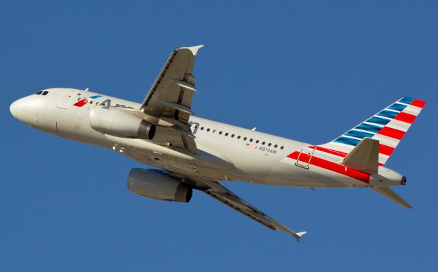 Airbus A319 (N814AW) - On the climb away from Reno-Tahoe Internationals runway 16R, this A319 is looking downright snazzy in its new AA garb.  