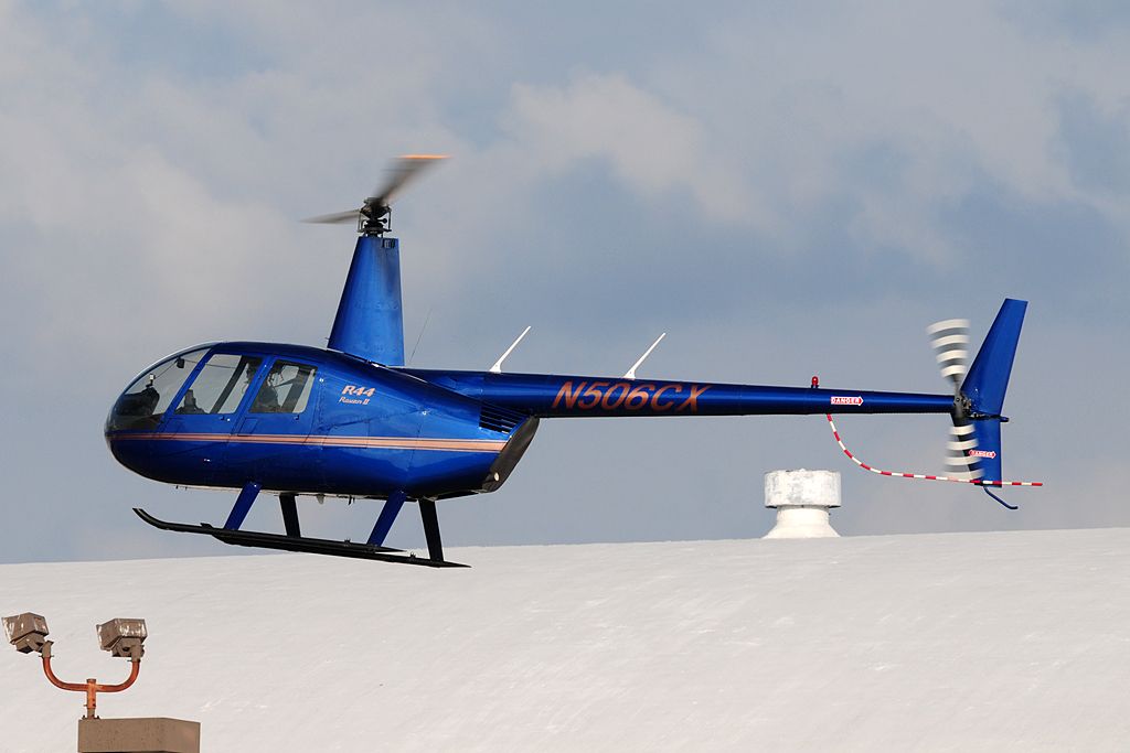 Robinson R-44 (N506CX) - Raven II landing in between the hangars. 