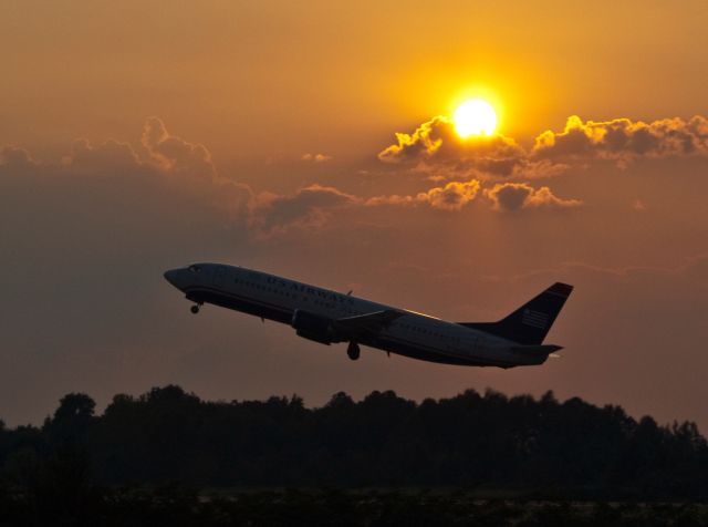 BOEING 737-400 (N404US) - "Goin to Houston, Babe." An evening departure from hot, stuffy Charlotte, North Carolina, USA to hot and humid Houston, Texas, USA. (IAH)