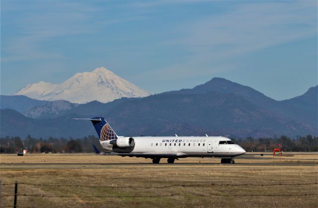 Canadair Regional Jet CRJ-200 (N918SW) - KRDD - 12/9/2019 1pm ish flight to SFO rolling to Runway 34 with snow laden Mt Shasta looking on from the north. Above the RJ, one can see the "burn scar" from the Mountain Fire July 2019 north of Redding proper.