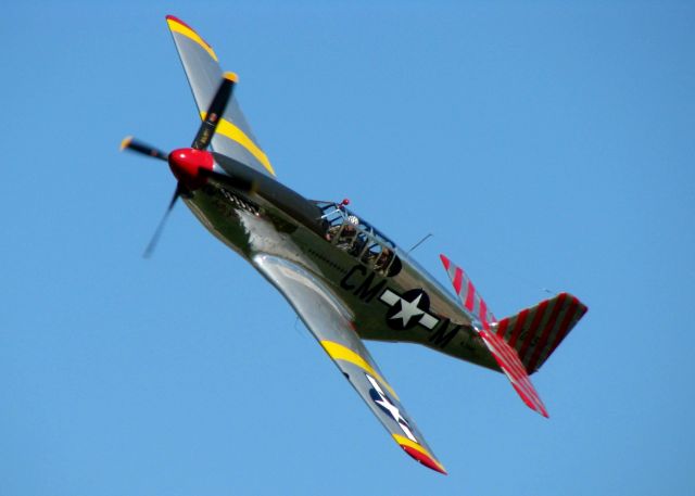 North American P-51 Mustang (N251MX) - Making a low pass over Downtown Shreveport. After landing and the pax taking the photo with the pilot and plane, when they said cheese, the poor guy lost his stomach all over wing and everywhere else within 5 feet of him. Felt so sorry for the elderly gentleman. 