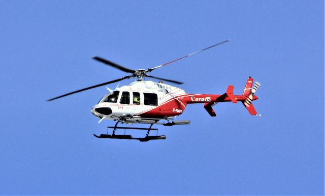 C-FMOT — - C-FMOT Bell-407 Garde Côtes Canadiennes survolant la ville de Lavaltrie QC. le 10-03-2022 à 09:37