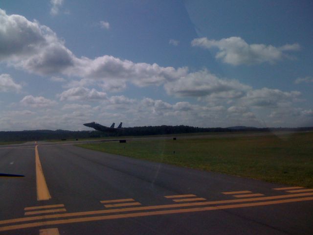 — — - F15C, 3rd in a flight of 3 taking off while I await an intersection departure - 8/5/08