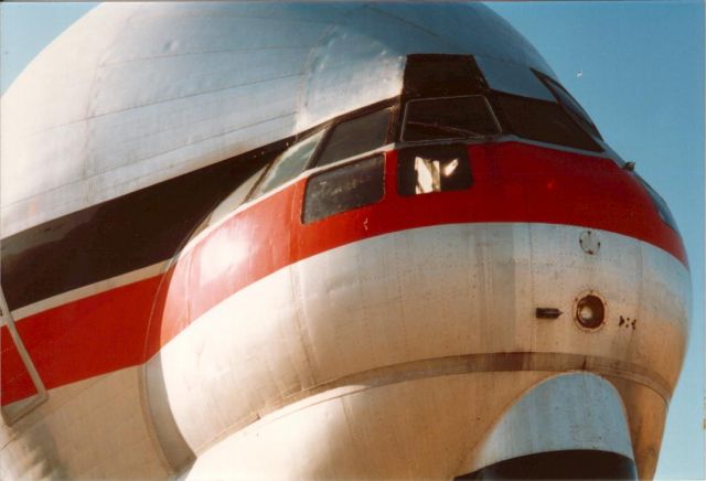 N422AU — - Erickson Boeing Straocruiser Guppy at Penticton BC Canada CYYF - Brought Skycrane S64 helicopter to remove another helicopter from a mountain. 1990