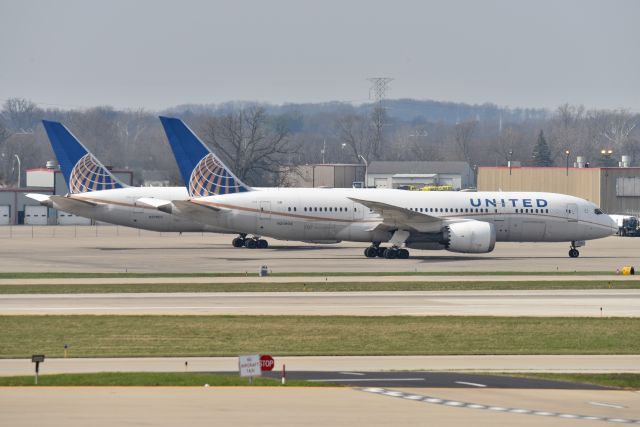 Boeing 787-8 (N20904) - Sister ship N27903 in the background. Both diverted to IND due ORD WX. 04-04-23.