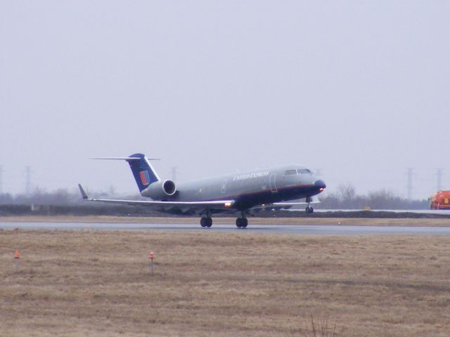 Canadair Regional Jet CRJ-200 (N857AE) - overcast day