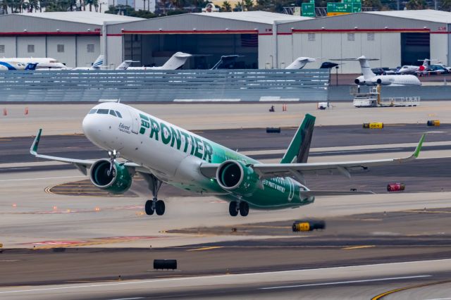 Airbus A321neo (N605FR) - A Frontier Airlines A321 neo "Edward the Bald Eagle" taking off from PHX on 2/14/23. Taken with a Canon R7 and Canon EF 100-400 II L lens.