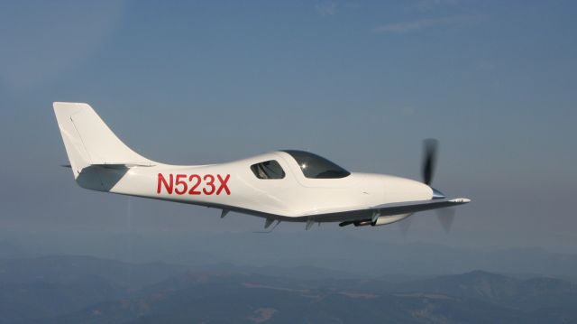 Lancair Legacy 2000 (N523X) - 2007 Lancair Legacy N523X (serial number L2K-426) and is shown over Oregon during test.  Aircraft was sold and now is registered as N241L with name on the cowling "Mary Leslie VI". 