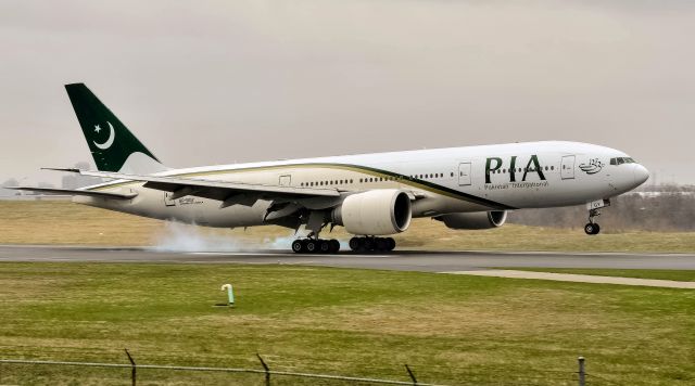 Boeing 777-200 (AP-BGY) - PIA 772L landing in light rain AP-BGY