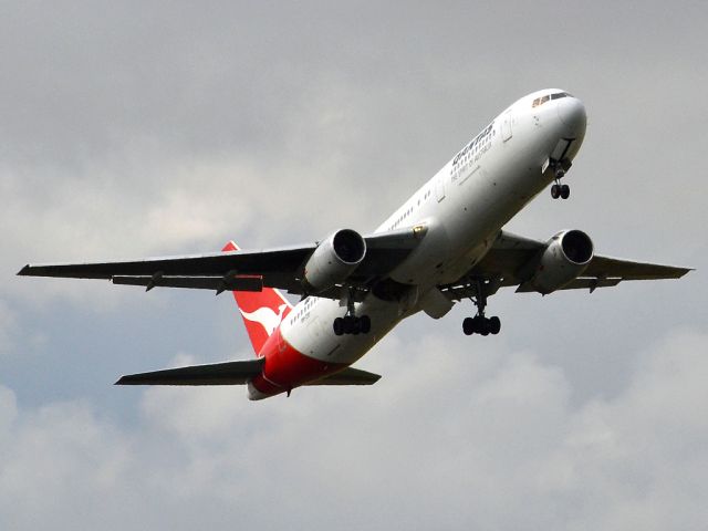 BOEING 767-300 (VH-ZXF) - Getting airborne off runway 23 0n a gloomy, cold winters day. Wednesday 4th July 2012.