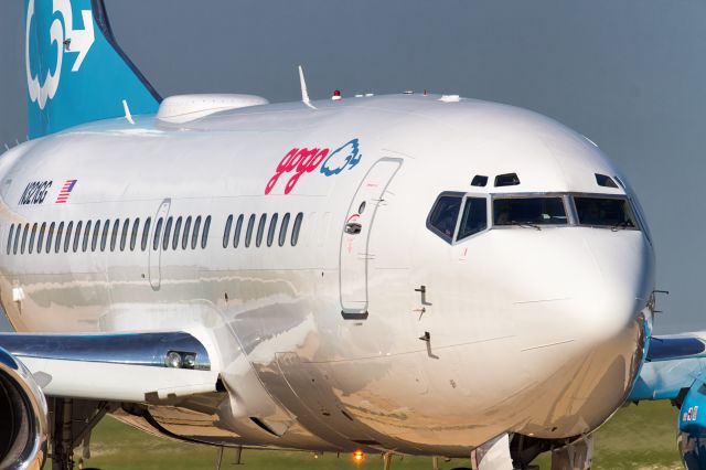 Boeing 737-500 (N321GG) - "Jimmy Ray" taxis by after landing on runway 27 at Aurora Municipal Airport in Sugar Grove, IL