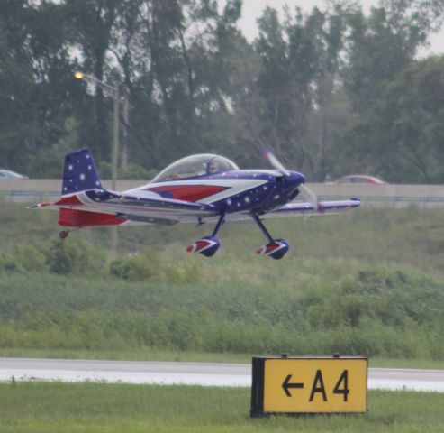 Vans RV-8 (N84JE) - Watching takeoff from "Alpha 4" taxiway at Gary Regional Airport. 