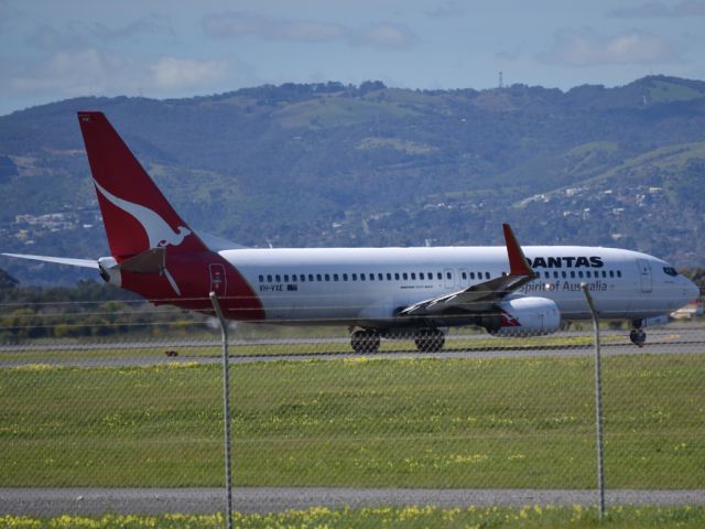 Boeing 737-800 (VH-VXE) - About to turn from taxi-way on to runway 05 for take off.