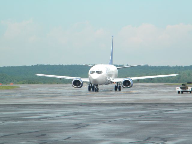 BOEING 737-400 (CXP412) - A shot of this charter after pushback from the gate. This aircraft will travel to Orlando-Stanford from Worcester.