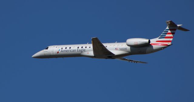 Embraer ERJ-145 (N602AE) - Shortly after departure is this 1998 American Eagle Embraer 145LR in the Winter of 2020.