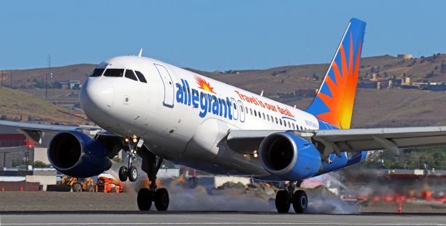 Airbus A319 (N310NV) - Touching the mains to 16L to complete a trip from McCarran (KLAS).