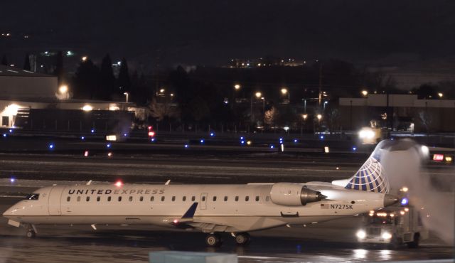 Canadair Regional Jet CRJ-700 (N727SK) - With the temperature just a few degrees above zero, Skywests first before-sunrise departure from Reno, Flt. 5579, is deiced on November pad prior to its New Years Eve trip to SFO.