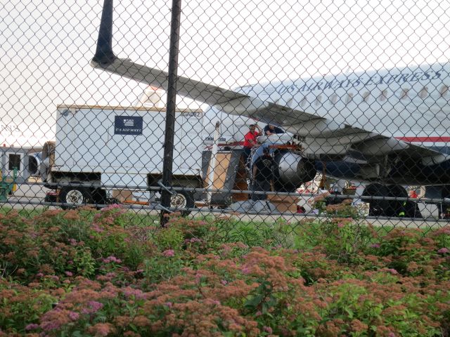 Embraer 170/175 (N136HQ) - US Airways maintenance working on a US Airways Express operated by Republic Airlines E170 N136HQ at Philadelphia International Airport (KPHL) on June 17, 2014.