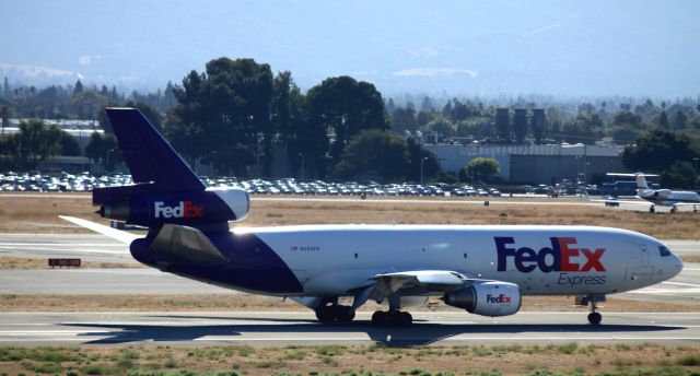 McDonnell Douglas DC-10 (N556FE) - Landing rollout, 30R