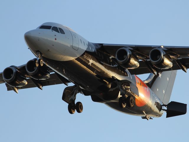 — — - Striking livery on this BAe 146 as it approaches London City Airport.