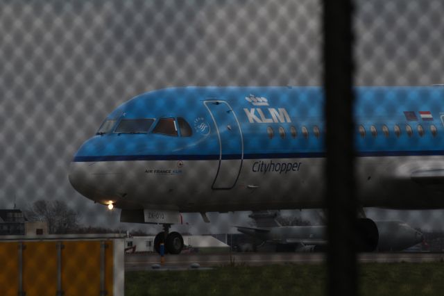 — — - Fokker 70, KLM Cityhopper, taxiing to the new runway Polderbaan at Schiphol Airport Amsterdam (Holland).
