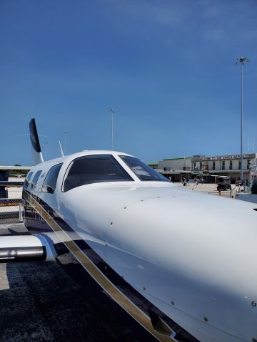 Piper Malibu Mirage (N350PF) - Airplane baking on the ramp at Key West International Airport (GA side)