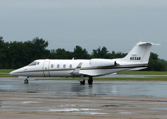 Learjet 55 (N55AR) - At Downtown Shreveport on a rainy day.