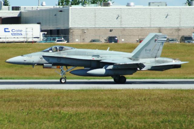 18-8748 — - After performing a go around this a/c landed on runway 25 and is heading for the ramp.   Picture taken on 01-July-11 in mid-morning.