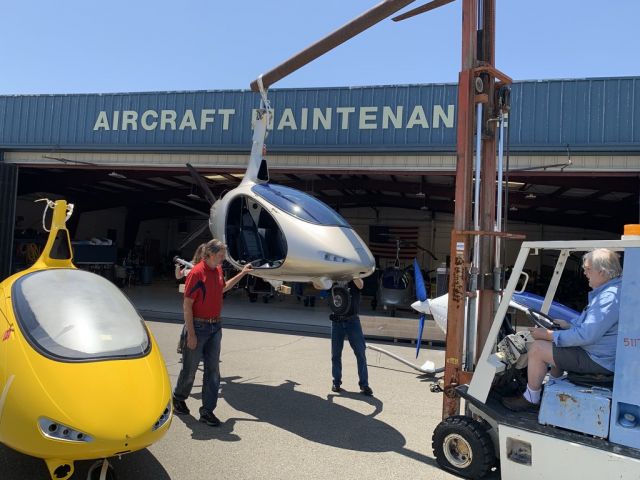 Unknown/Generic Ultralight autogyro (N180RS) - Three AutoGyro Cavalon Gyroplanes being unloaded on one fine summer day. The Certified Mercedes Gold Gyro in the center is owned by me. I'm retired and have had quite a bit of training from the three excellent instructors at this location. The head instructor Michael Burton is in a red shirt. I'm not in any way related to them - just a very satisfied customer with more than 70 hours in this side by side type which is a blast to fly.