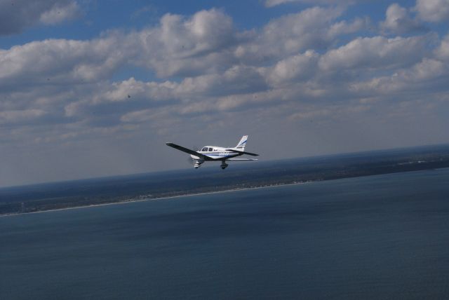 Piper Cherokee (N19AV) - Rt base to final at KMYR Cleared to land Cherokee flight of 5 C2O