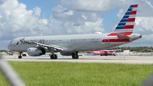 Airbus A321 (N977UY) - Taken from Rwy 10L viewing area.