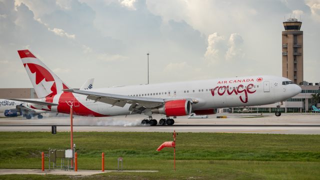 BOEING 767-300 (C-FXCA) - Air Canada Rouge 767 landing on runway 10R